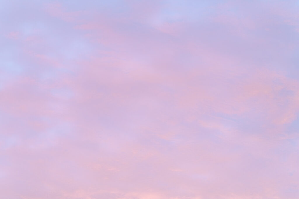 pink clouds affected by sunset reflection golden hour.